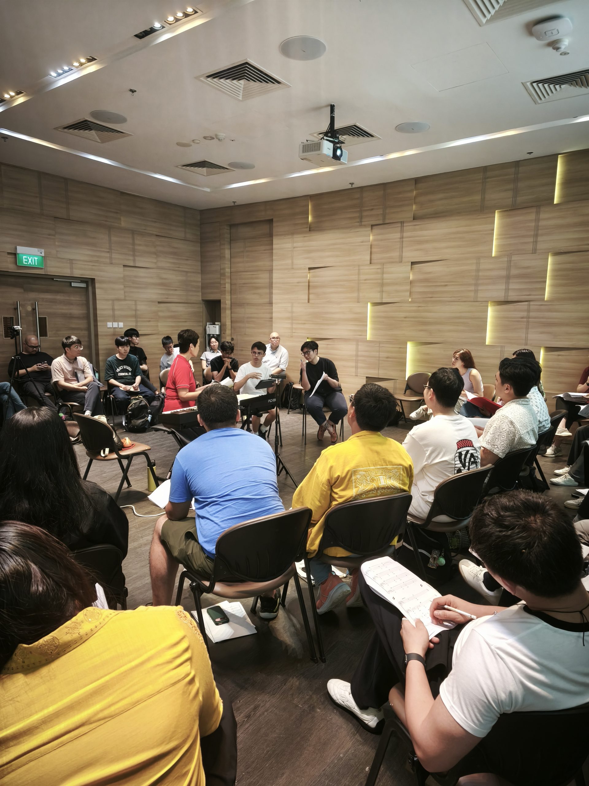 Young composer, Thomas Rettig, with mentor Alicia de Silva and artistic director Jennifer Tham during reading of his work 'Greenland'