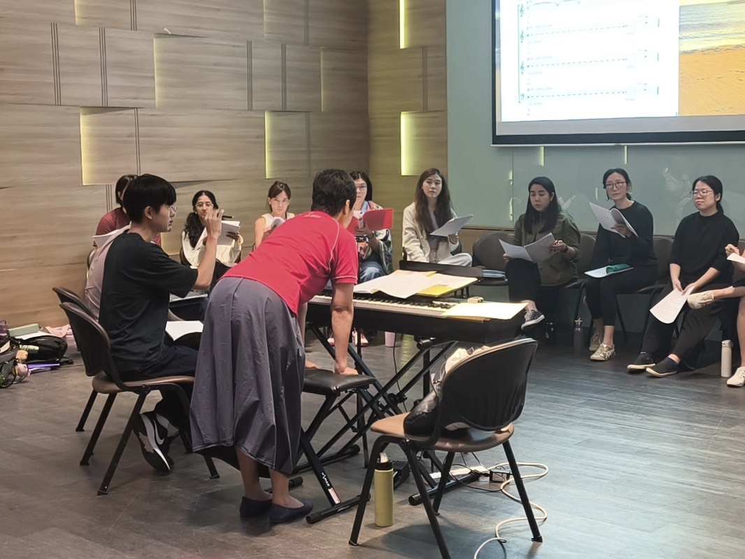 Young composer, Bae Junsoo, with mentor Ding Jian Han and artistic director Jennifer Tham during reading of work 'luminate'